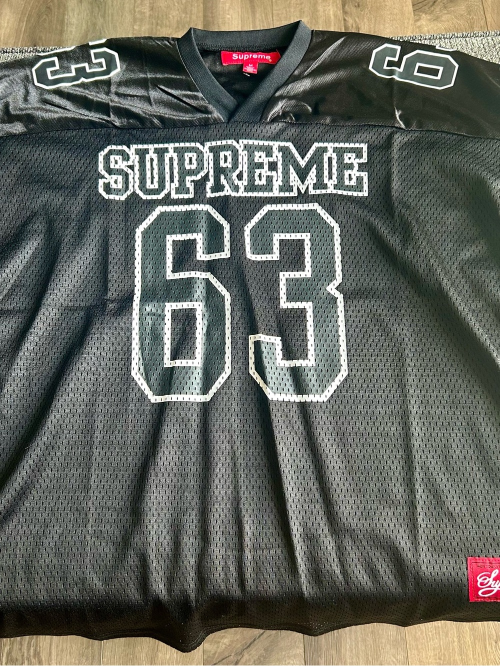 Black supreme football jersey